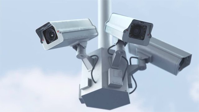 Security cameras against blue sky in 4K