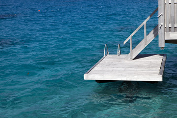 wooden steps to a scaffold for bathing in the sea
