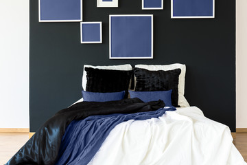 Blue posters above bed