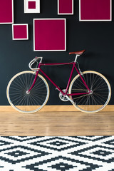 Pink bicycle against wall