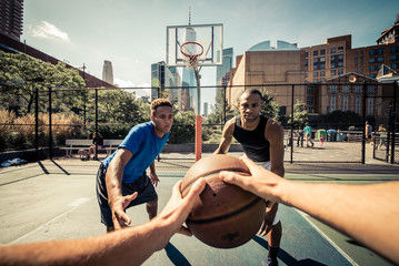 Two street basketball players playing hard on the court - obrazy, fototapety, plakaty