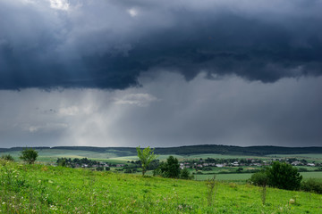 Approaching summer storm in the field