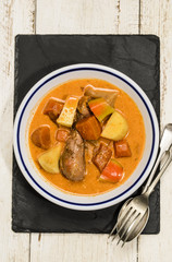 hungarian chicken stew with salted potato, bell pepper and sauce with sour cream