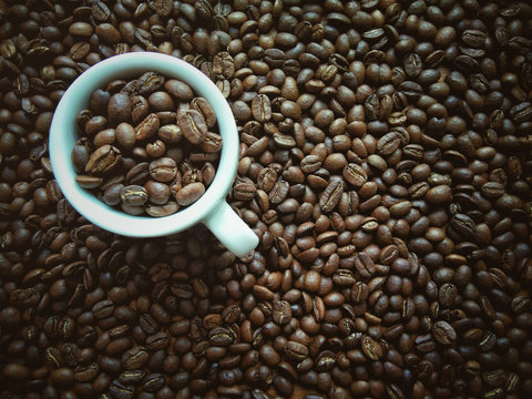 Art, vintage, a white coffee cup on coffee bean