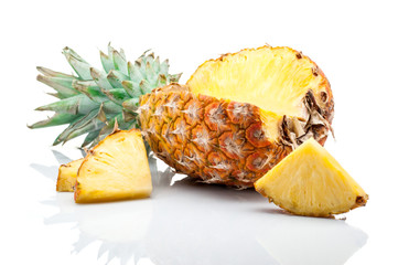pineapple with slices isolated on white