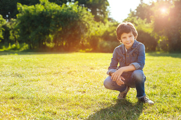 Motivated nice kid playing outside