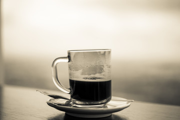 Americano coffee in a glass cup, black and white 