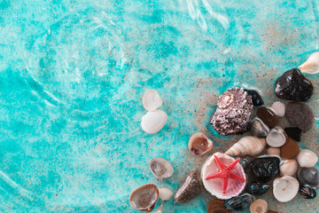 Vacation concept with starfish ,seashells on blue water,summer holiday concept