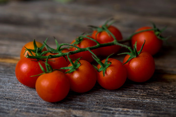 Cherry tomatoes on a wooden surface
