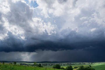 Obraz na płótnie Canvas Approaching summer storm in the field