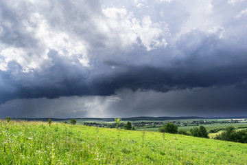 Approaching summer storm in the field