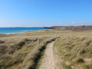 Sand path on the Brittany coast, France