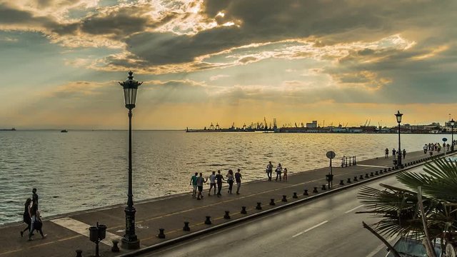 Thessaloniki Port View, before sunset, with comutters and car traffic near the sea road