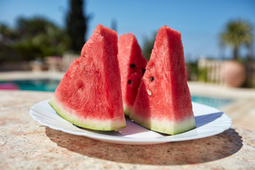 Watermelon, cut slices on a plate.