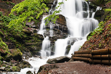 Obraz premium Carpathians. Powerful waterfall on a mountain river. Ukraine.