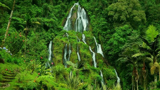 Waterfalls at Santa Rosa de Cabal, Colombia. Beautiful Waterfall inside the forest. Cascade in a green Mountain. Epic Waterfall background full hd and 4k. Natural beauty background. Ecology Concept.