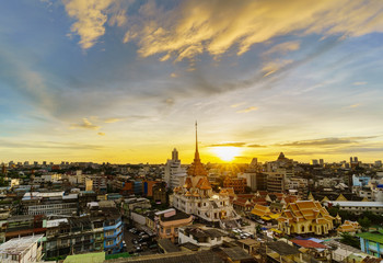 Naklejka premium Cityscape of beautiful Wat Traimit or Temple of the Golden Buddha where the biggest solid golden Buddha statue is installed near the Chinatown , Bangkok , Thailand