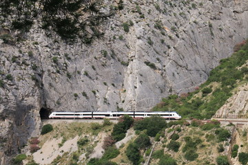 Fototapeta premium Train crossing a tunnel in Caminito del Rey, Malaga, Spain