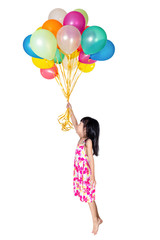 Asian little Chinese girl flying with colorful balloons