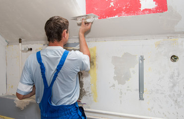 Hands plasterer at work