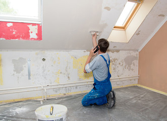Hands plasterer at work