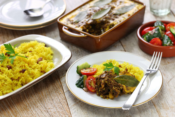 bobotie and yellow rice, south african cuisine.
bobotie is a curry flavored meatloaf with baked egg on top.