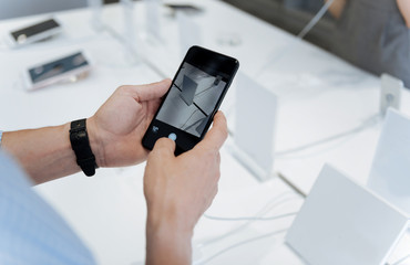 Close up of male hands taking pictures with template cellphone