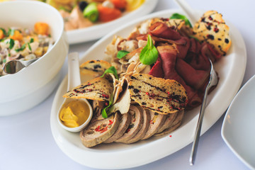 Decorated catering banquet table with different food appetizers assortment on a party
