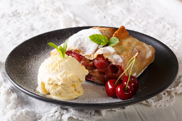 Healthy cherry strudel and vanilla ice cream. horizontal