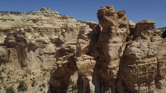 Aerial beautiful Eagle Arch San Rafael Utah descend. San Rafael Swell a large geologic feature located in south central Utah near Green River. Giant dome anticline of sandstone, sedimentary rocks.