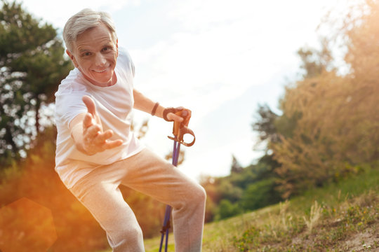 Joyful friendly man offering you help