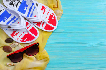 Summer blue background. Top view of beach summer accessories on blue wooden background with copy space. Horizontal frame for spa or wellness concept