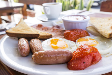 classical english breakfast with egg and ham