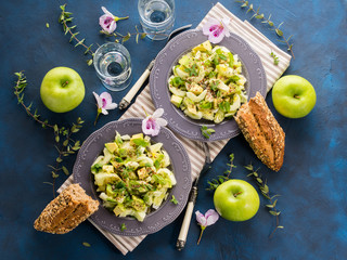 Green Avocado cucumber salad with lettuce, apple and pumpkin flex sunflower seeds. Diet detox food lunch