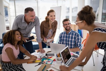 Team of executives working together in the office