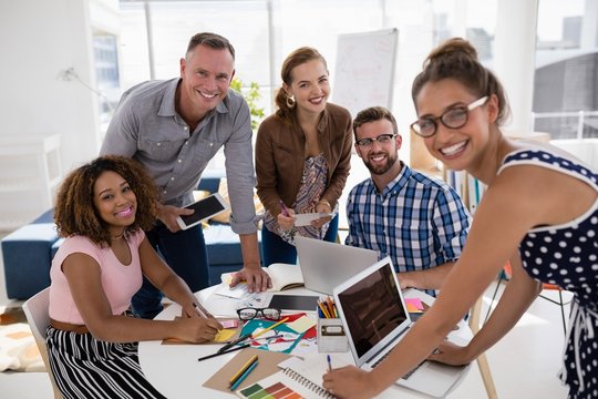 Team Of Executives Working Together In The Office