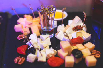 Decorated catering banquet table with different food appetizers assortment on a party
