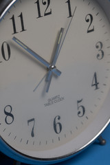 Fototapeta premium Closeup of hands on clock face. Time concept