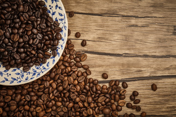 Lovely coffee beans with wooden table