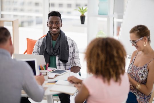 Male executive working with his coworkers in the office