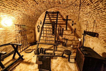 Medieval torture chamber with plenty of tools - obrazy, fototapety, plakaty