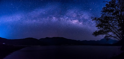 Stars and the milky way in the sky over the lake.