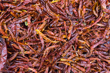 piles of dried red chilli  in market