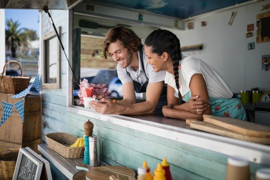 Waiter and waitress interacting with each other