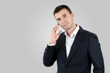 Man using smart phone on gray background