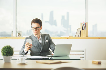 White businessman using cellphone