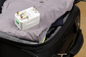 Travel power adapter with connectors for european, UK, and US power plugs