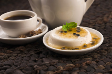 Panna cotta dessert with passion fruit and mint