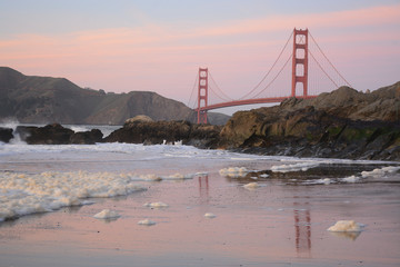 Golden Gate Bridge from Baker Beach with waves crashing, San Francisco