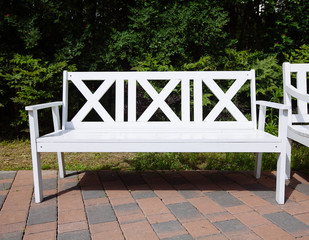White Wooden Benches in the park, summer day